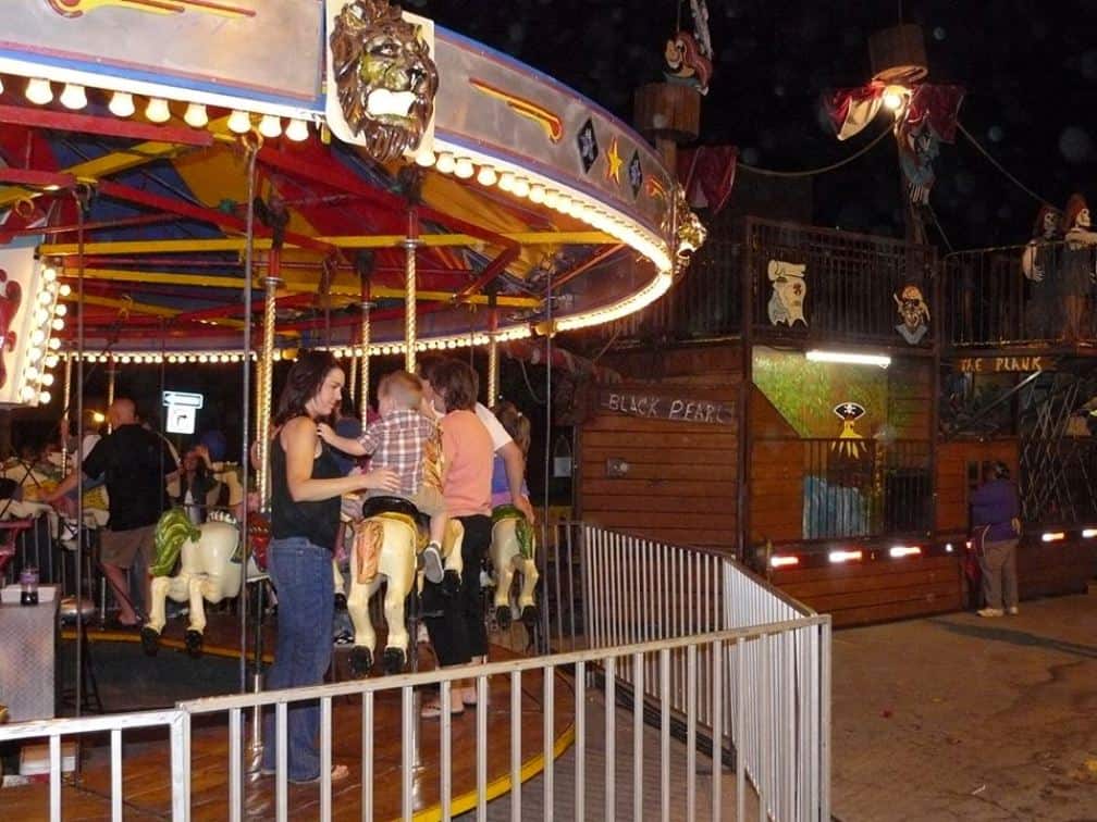 Kansas City Fall Festivals - kids on a carousel at Liberty Fall Festival