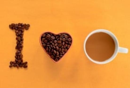 Coffee beans and coffee in a mug