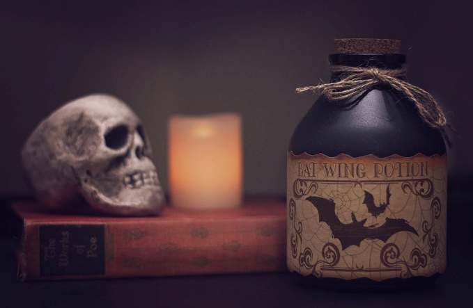 Kansas City Halloween Parties and Events for Adults - Skull, candle and bottle of bat potion