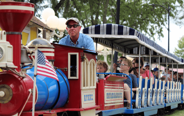 Kansas State Fair - man driving a kids train ride with several kids 