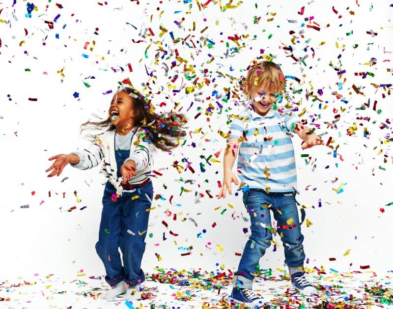 New Year's Eve Parties for kids in Kansas City - two kids dancing in confetti