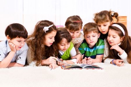 Kids reaching books