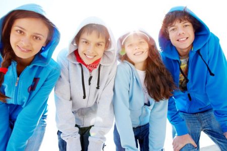 Free and Cheap Fun for kids in Kansas City - four kids dressed in hooded coats