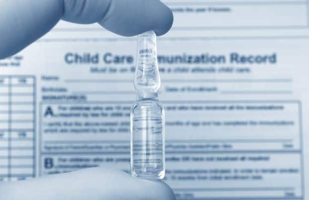 back-to-school vaccinations - vaccine vial and child care immunization records