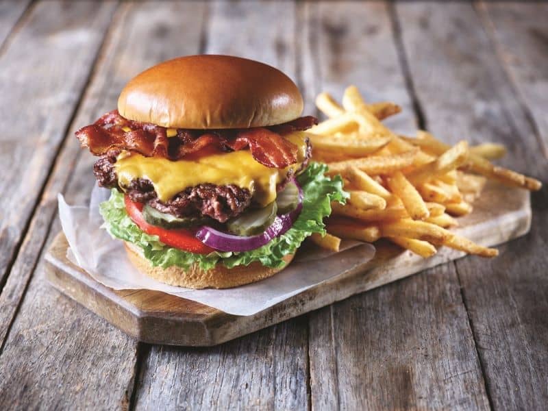 National Cheeseburger Day - Applebee's classic bacon cheeseburger with fries on a plate