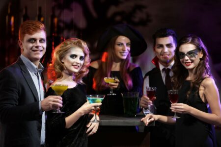 Free and Cheap Kansas City Halloween Parties and Events for Adults - young people in Halloween costumes holding drinks