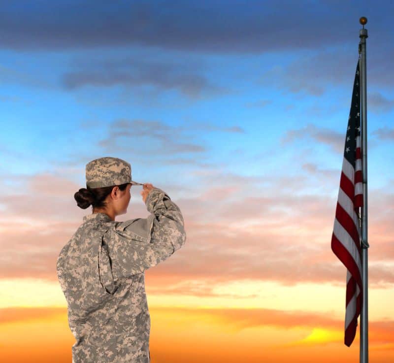 Kansas city Veterans Day Events and Deal - female solider saluting American flag
