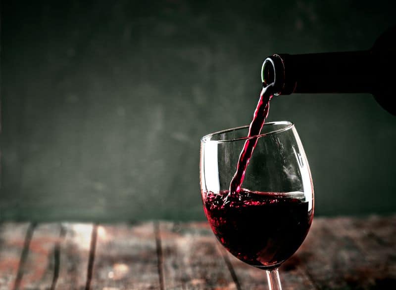 Kansas City restaurant deals - red wine being poured into a glass