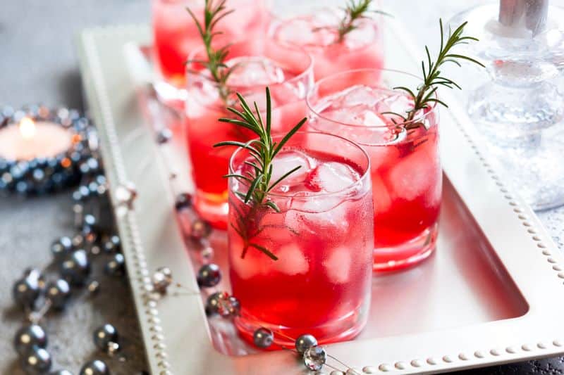 Christmas pop-up bars in Kansas City - festive cocktails with rosemary sprigs