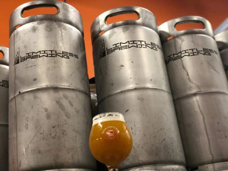 Limitless Brewing in Lenexa, KS - three kegs and a glass of beer