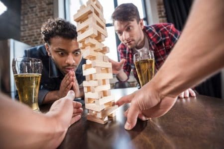 Indoor fun in Kansas City -friends playing Jenga game