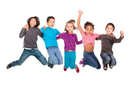 Children jumping with balloons at a free family event in Kansas City YMCA North Kansas City