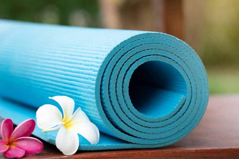 free and cheap yoga in Kansas City - rolled up yoga mat