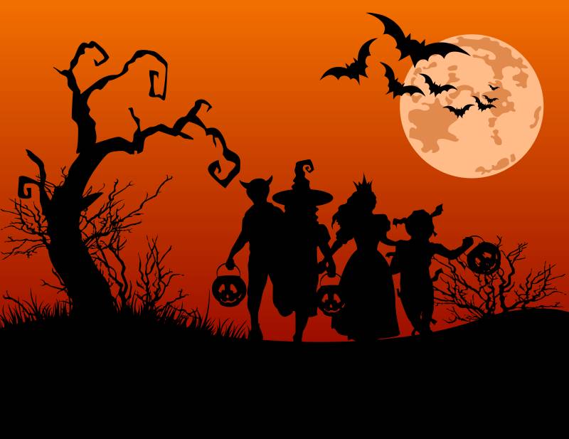 Silhouette of kids trick-or-treating for Halloween