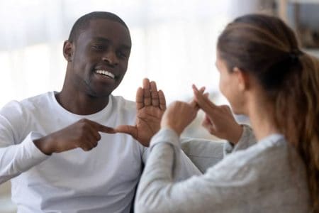 Friends talking using sign language