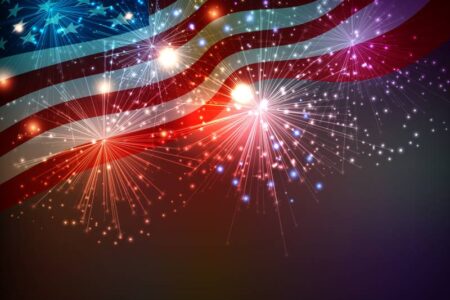 Fourth of July fireworks with an American flag background