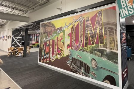 Johnson County Museum Entrance Exhibit Sign with Large Museum Wording and a 50's Style Car